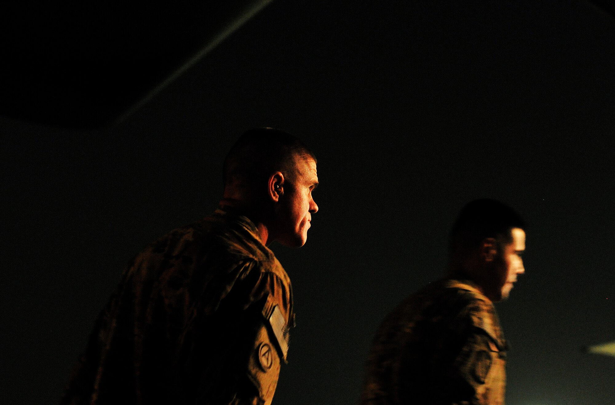 U.S. Army members with the Inter Theater Care Program (ITCP) make their way out to a U.S. Air Force C-130 Hercules, which will transport them back to their deployed organizations, undisclosed location, Southwest Asia, August 30, 2012. These members are part of ITCP because they suffered from combat related injuries in the AOR. The ITCP was established in order to care for injured troops, who were able to be rehabilitated and returned to their respective units within the AOR.   (U.S. Air Force photo/Staff Sgt. Clay Lancaster/ Released)
