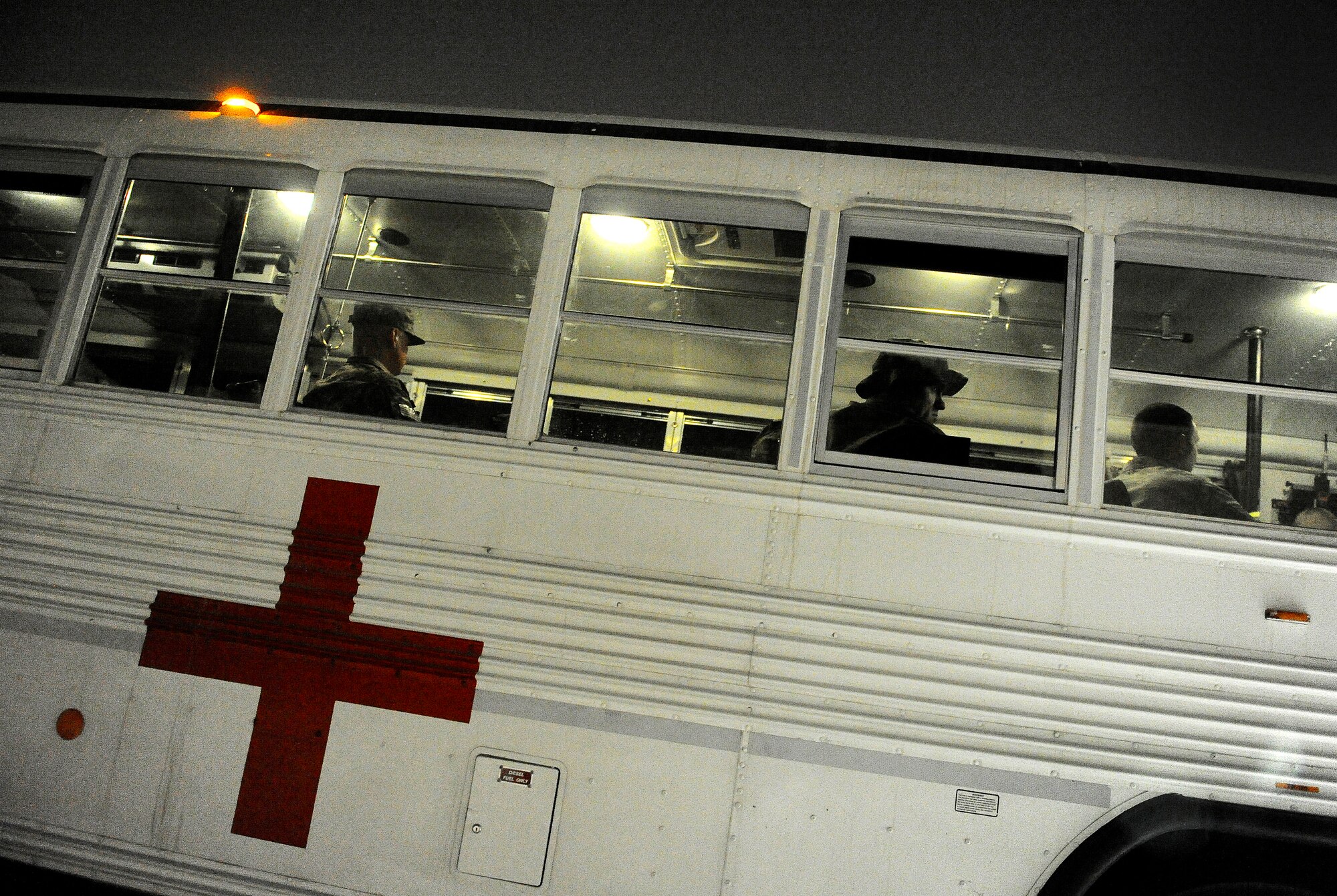 U.S. Army members with the Inter Theater Care Program (ITCP) await travel out to a U.S. Air Force C-130 Hercules, which will transport them back to their deployed organizations, undisclosed location, Southwest Asia, August 30, 2012. These members are part of ITCP because they suffered from combat related injuries in the AOR. The ITCP was established in order to care for injured troops, who were able to be rehabilitated and returned to their respective units within the AOR.   (U.S. Air Force photo/Staff Sgt. Clay Lancaster/ Released)
