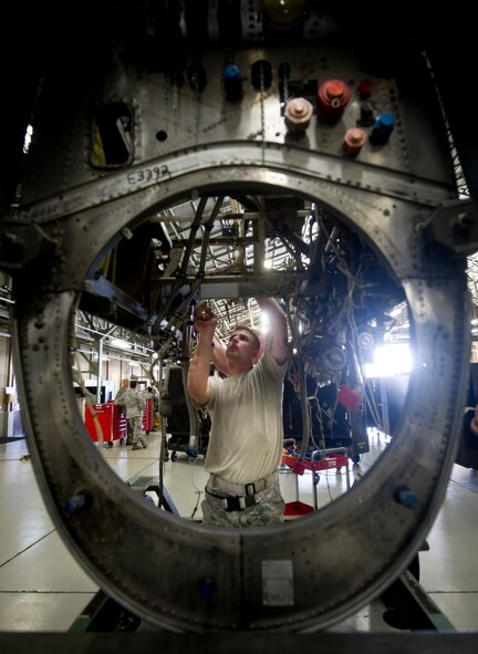YOKOTA AIR BASE, Japan -- Airman 1st Class Jacob Hall, 374th Maintanance Squadron propulsion flight aerospace propulsion apprentice, installs panels in a spare engine after a final inspection at Yokota Air Base, Japan on Sept. 11, 2012. Minor engine problems are fixed directly on the flightline, but major cases, such as foreign object damage or internal components damage, are fixed at the propulsion shop. (U.S. Photo by Staff Sgt. Stacy Moless)
