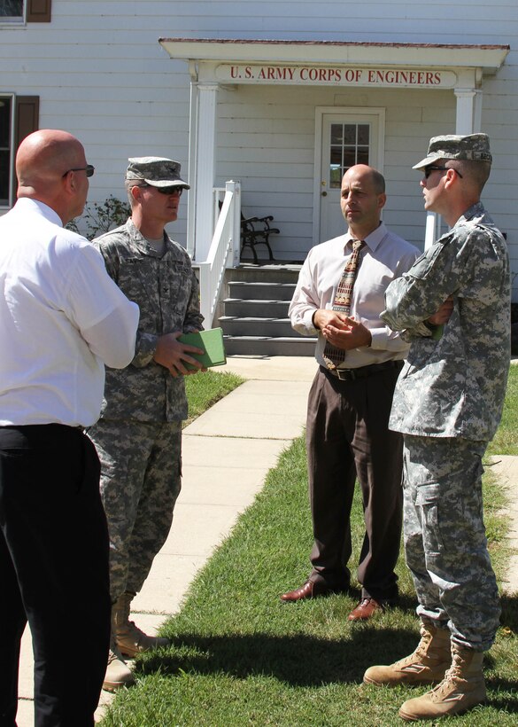 Col. Kent Savre, Commander of the North Atlantic Division (left), speaks with Philadelphia District Commander LTC Chris Becking, chief of operations Tony DePasquale (right), and Deputy for Programs and Project Management Curt Heckelman (left) during a visit to the Chesapeake & Delaware Canal Sept. 11. 