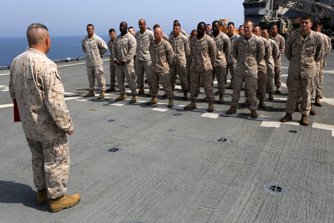 USS GUNSTON HALL, Arabian Gulf (Sept. 11. 2012) -Master Sgt. James Clark, a Louisville, Ky., native and maintenance chief for Combat Logistics Battalion 24, 24th Marine Expeditionary Unit, reenlists in the Marine Corps Sept. 11, on the flight deck of the USS Gunston Hall in the Arabian Gulf. The 24th MEU is deployed with the Iwo Jima ARG as a theater reserve force for U.S. Central Command and is providing support for maritime security operations and theater security cooperation efforts in the U.S. Navy's 5th Fleet area of responsibility. (Official Marine Corps photo by Sgt. Richard Blumenstein) 