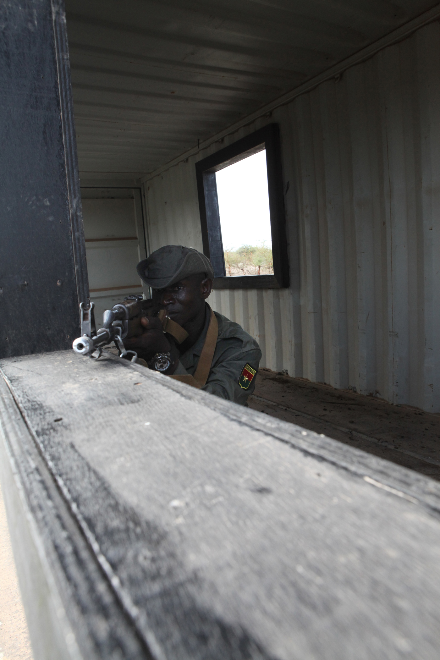 A member of the Burkina Faso army participating in Exercise Western Accord 2012, practices clearing a window at urban combat techniques training, July 13. U.S. service members, primarily Reservists from the Marines, Army, Navy, and Air Force are taking part in WA-12 -- a multi-lateral exercise with Senegalese and several Western African nations. The training exercise runs from June 26 - July 24 and involves Armed Forces of Senegal, Burkina Faso, Guinea, Gambia and France.