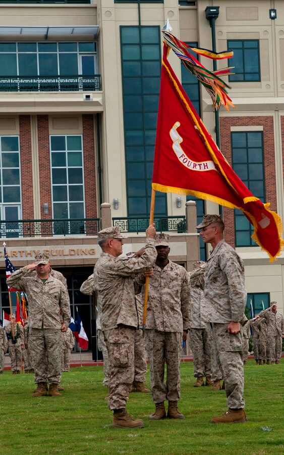 Brig. Gen. James S. Hartsell receives the Marine Corps colors from Maj. Gen. James M. Lariviere during the 4th Marine Division change of command ceremony at the Marine Corps Support Facility New Orleans, Sept. 8. The passing of the colors is a symbol of exchanging command responsibility and leadership. Lariviere will serve at the Pentagon after two and a half years of leading 4th MarDiv.