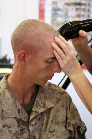 Recruits of Co. G, 2nd Recruit Training Battalion, recieve their weekly haircuts aboard Marine Corps Recruit Depot San Diego, Sept. 5. The weekly hairduts are part of the process towards teaching recruits how to maintain a Marine image. 