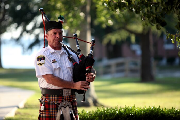 – Kevin White, the Indian Beach Fire Department chief, plays the bagpipe during the Law Enforcement Fellowship dinner aboard Marine Corps Base Camp Lejeune Sept. 11. After everyone spoke at the dinner, White played “Amazing Grace” on the bagpipe, which was followed by a moment of silence to remember the first responders who lost their lives on 9/11.