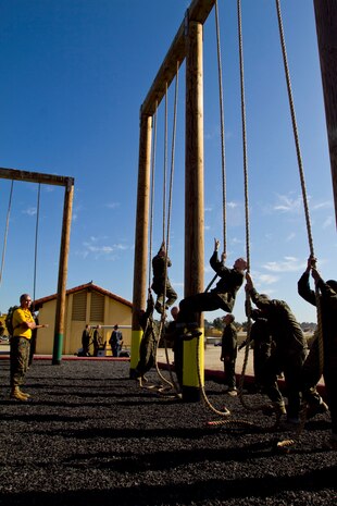 Recruits of Company F, 2nd Recruit Training Battlion, climb the rope during the obstacle course aboard Marine Corps Recruit Depot San Diego Sept. 7. Recruits were only allowed to climb the rope halfway since it was the introduction to the course.