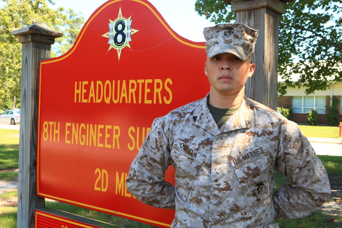 Cpl. Patricio Canela, Jr., an administrative clerk with 8th Engineer Support Battalion, 2nd Marine Logistics Group, poses for a picture after joining two other New York City Marines aboard Camp Lejeune, N.C., Sept. 10, 2012, to commemorate the eleventh anniversary of the Sept. 11 attacks. Canela grew up in Queens, N.Y. He was 14 years old on the day of the attacks, and he said he enlisted in the Marine Corps after meeting servicemembers while traveling overseas. 