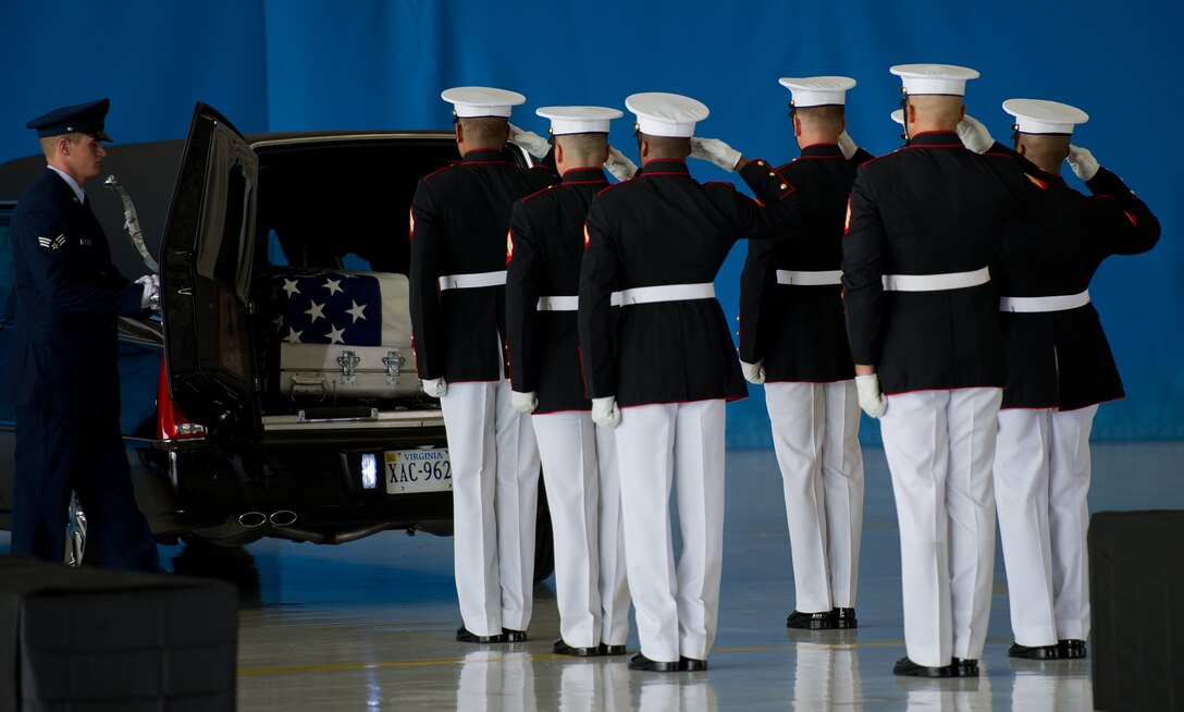 The United States Marine Corps Honor Guard salutes the remains a fallen U.S. Foreign Service member, Sept. 14, 2012, at Joint Base Andrews, Md. The U.S. State Department held a ceremony on base to honor the Americans who gave their lives in service to their country. (U.S. Air Force photo by Senior Airman Perry Aston)