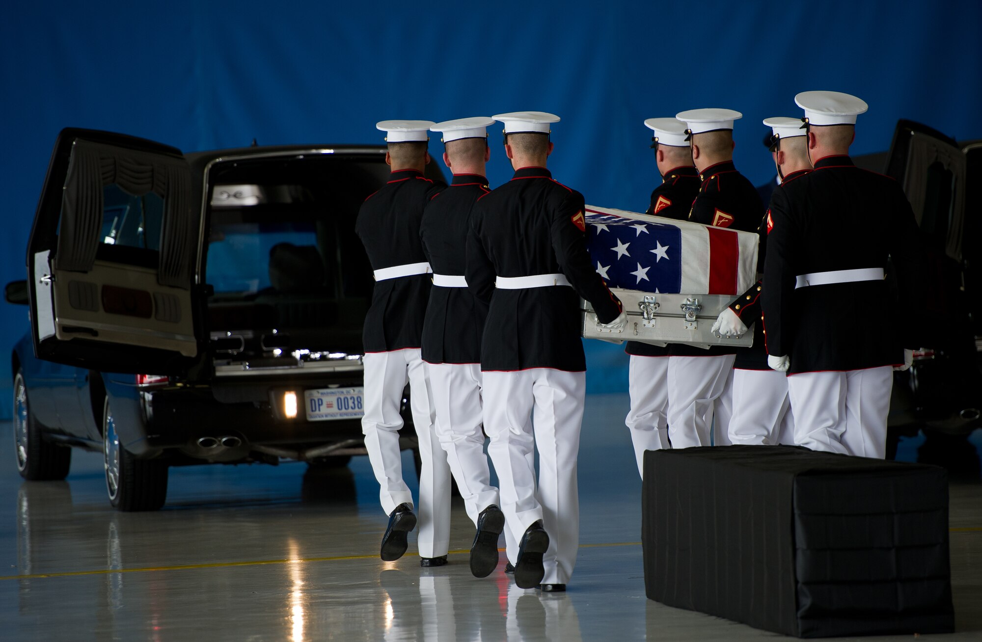 The United States Marine Corps Honor Guard move the remains of a fallen U.S. Foreign Service member into a hearse Sept. 14, 2012, at Joint Base Andrews, Md. The U.S. State Department held a ceremony on base to honor the Americans who gave their lives in service to their country. (U.S. Air Force photo by Senior Airman Perry Aston)