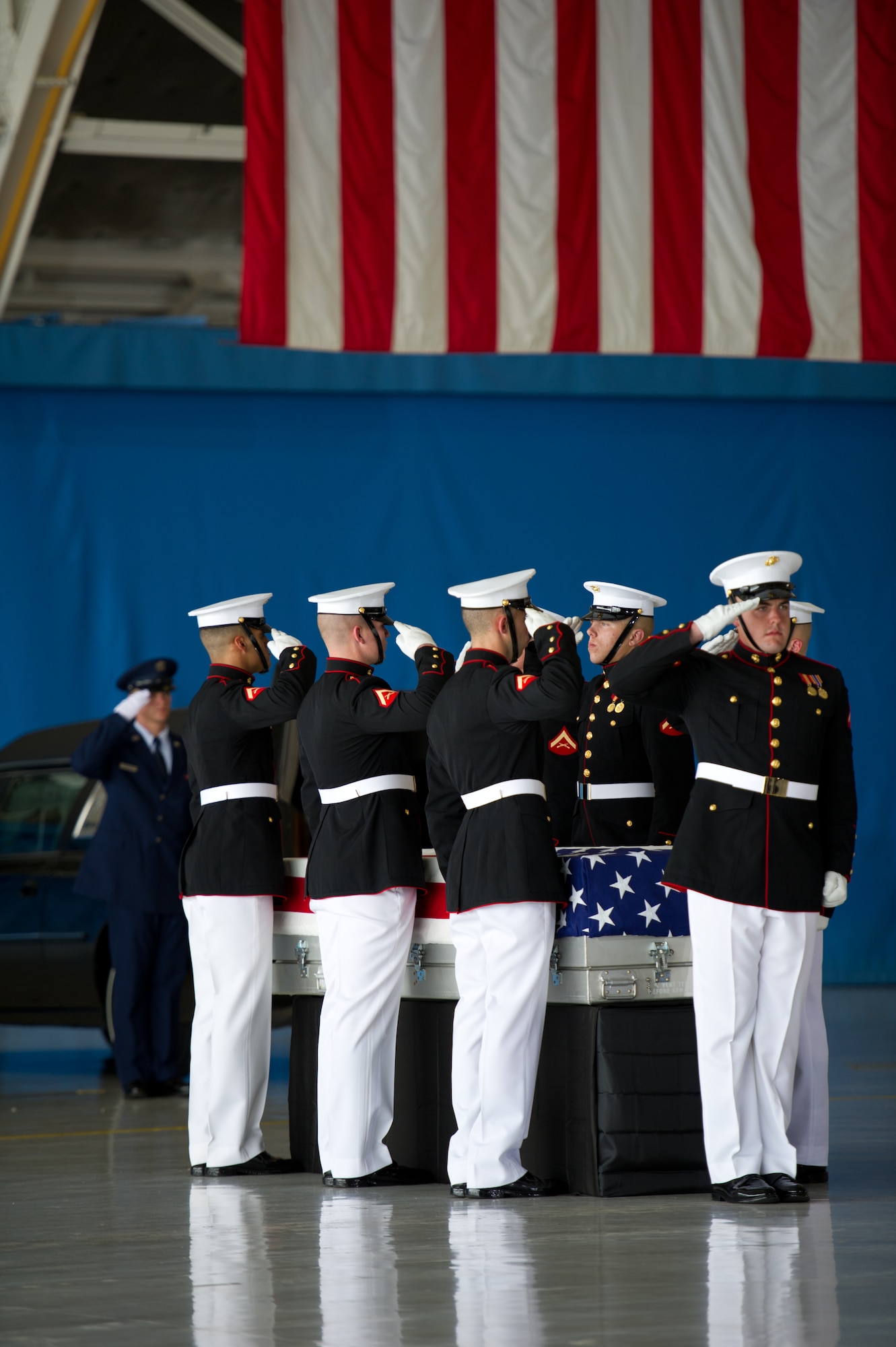 The United States Marine Corps Honor Guard prepares to carry the remains of one of the fallen U.S. Foreign Service members, Sept. 14, 2012, at Joint Base Andrews, Md. The U.S. State Department held a ceremony on base to honor the Americans who gave their lives in service to their country. (U.S. Air Force photo by Senior Airman Perry Aston)