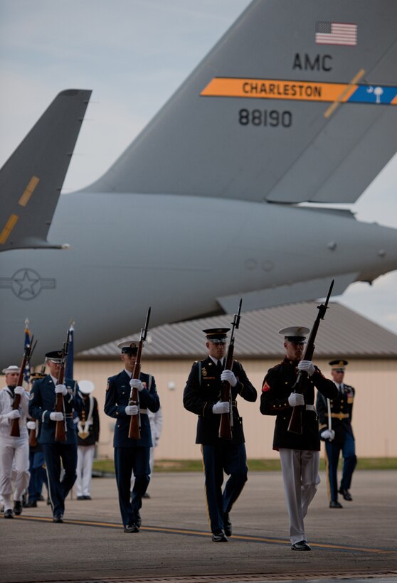 A Joint Forces Honor Guard marches during the dignified transfer of remains for J. Christopher Stevens, U.S. ambassador to Libya, and three other Americans, Sept. 14, 2012, at Joint Base Andrews, Md. The U.S. State Department held a ceremony on base to honor the Americans who gave their lives in service to their country. (U.S. Air Force photo/Senior Airman Perry Aston)