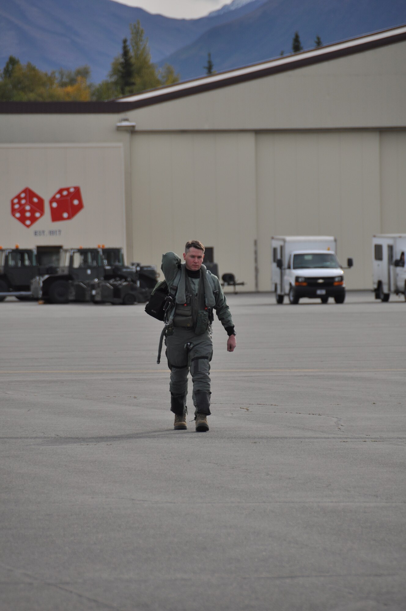 Lt. Col. Nicholas Reed, 90th Fighter Squadron commander, steps to his
aircraft in prior to deploying to Andersen Air Force Base, Guam. This marks the first time since 2011 F-22's from the 3rd Wing have deployed to the Pacific Theater of Operations.  (U.S. Air Force Photo/Tech. Sgt. Dana Rosso)
