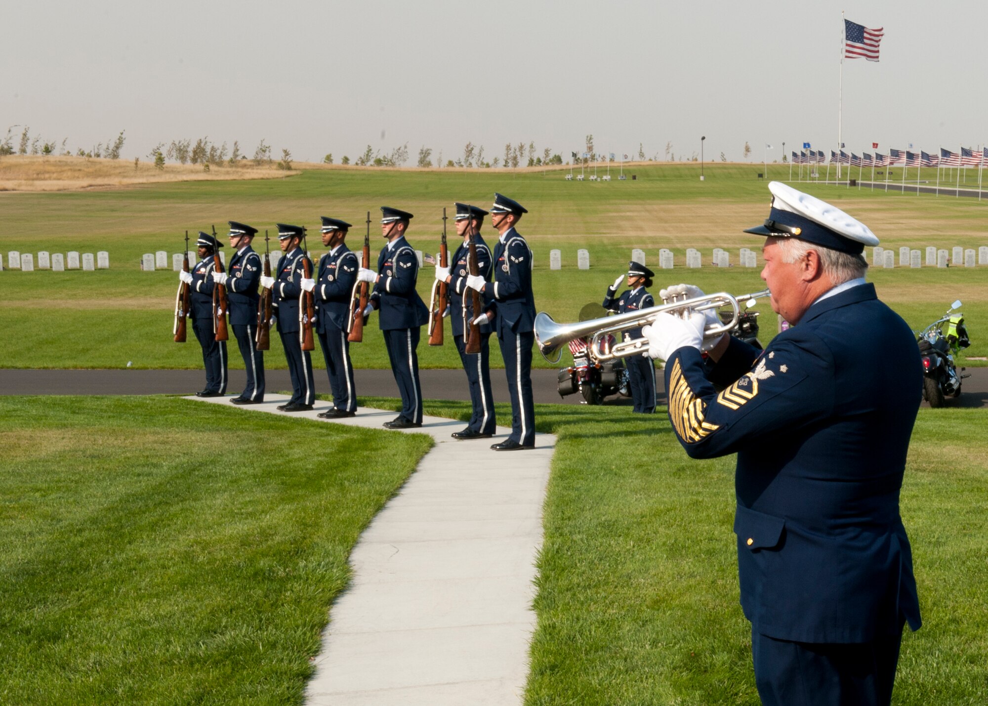 Members of the Joint Service Honor Guard perform military honors for the remains of 20 veterans and one spouse for the Missing in America Project at Washington State Veterans Cemetery in Medical Lake, Wash., Sept. 10, 2012. The honor service included a flag folding, rifle salute and the playing of taps. (U.S. Air Force photo by Staff Sgt. Michael Means)