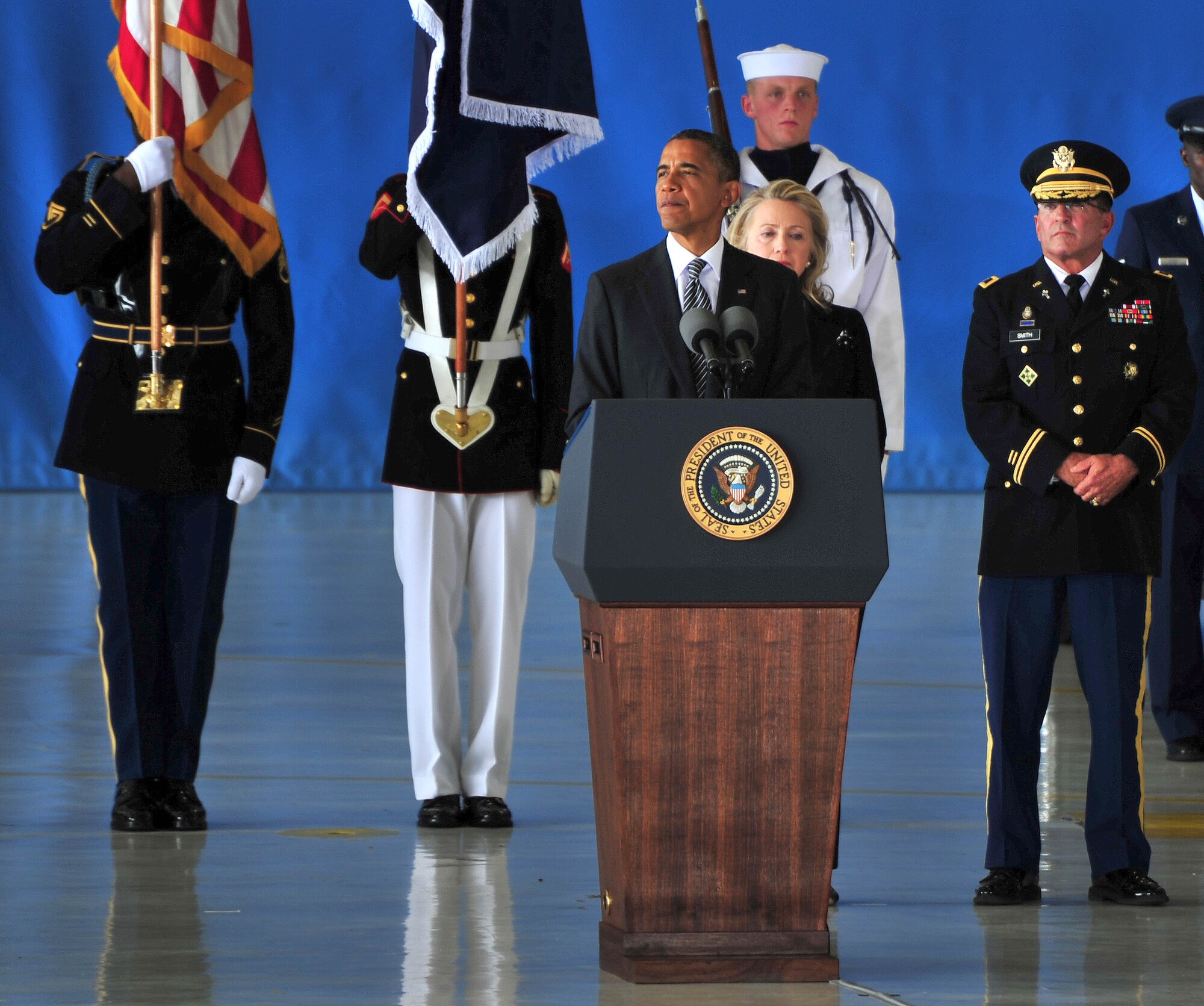 Commander in Chief Barack Obama pauses during a speech Sept. 14 at Joint Base Andrews, Md., to reflect on the lives of individuals killed during attacks to the U.S. consulate Sept. 11, 2012, in Benghazi, Libya. Obama took time with family, friends and service members at the dignified transfer ceremony to honor the sacrifices J. Christopher Stevens, Sean P. Smith, Glen A. Doherty and Tyrone S. Woods made in service to the United States and countries abroad. Ceremonial guard members from across the National Capital Region, representing all branches of the Department of Defense, rendered final honors to the deceased during the ceremony. (U.S. Air Force photo by Senior Airman Steele C. G. Britton)