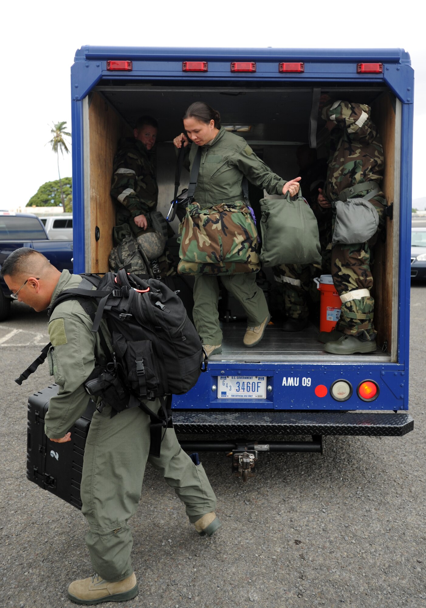 Exercise participants exit a "bread truck" during an Operational Readiness Exercise scenario on the 15th Wing flightline Sept. 13 at Joint Base Pearl Harbor-Hickam, Hawaii. The exercise's participants were tested on their ability to properly react to a broad range of scenarios and environmental conditions. (U.S. Air Force photo by Staff Sgt. Nathan Allen) 