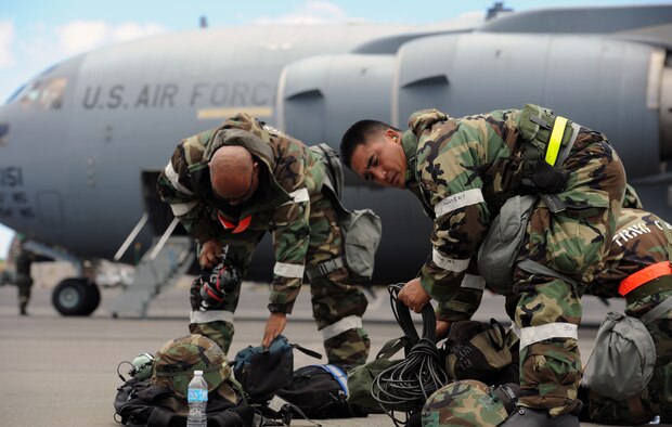 Staff Sgt. Darrin Kahala, 154th Aircraft Maintenance Squadron KC-135 Stratotanker aircraft mechanic (left), and Senior Airman Brandon Solidum, 154th Aircraft Maintenance Squadron crew chief, pack equipment during an Operational Readiness Exercise scenario on the 15th Wing flightline Sept. 13 at Joint Base Pearl Harbor-Hickam, Hawaii. The exercise's participants were tested on their ability to properly react to a broad range of scenarios and environmental conditions. (U.S. Air Force photo by Staff Sgt. Nathan Allen) 