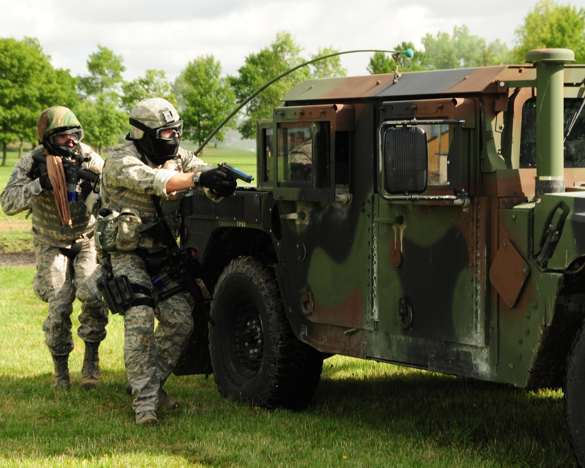 914th Logistics Readiness and Security Forces Squadron members protect each other’s back in an exercise involving opposing forces at Niagara Falls Air Reserve Station, NY on September 8, 2012. The exercise was conducted over the September Unit Training Assembly (UTA) weekend and involved approximately 75 individuals. (US Air Force photo by Peter Borys)