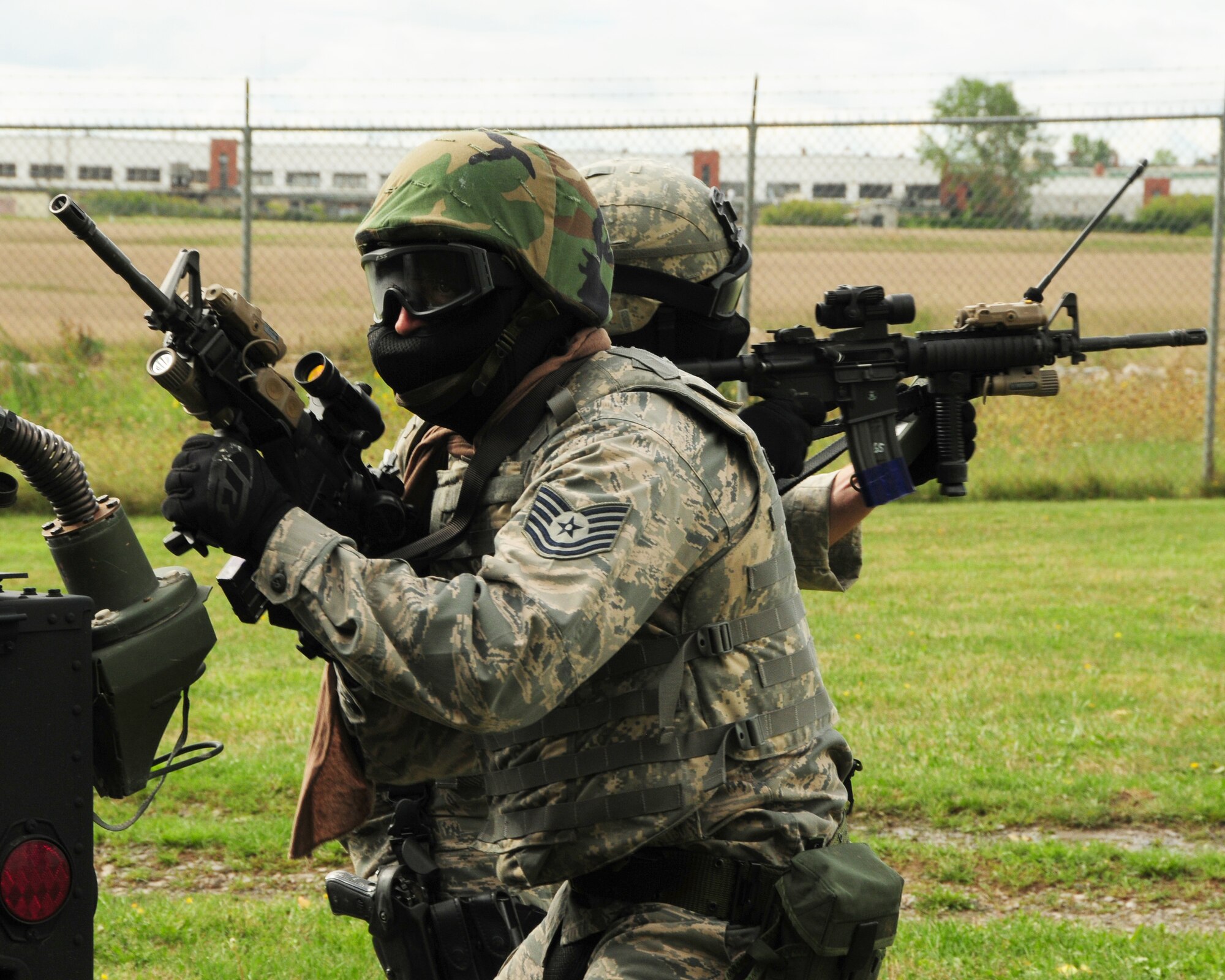 914th Logistics Readiness and Security Forces Squadron members protect each other’s back in an exercise involving opposing forces at Niagara Falls Air Reserve Station, NY on September 8, 2012. The exercise was conducted over the September Unit Training Assembly (UTA) weekend and involved approximately 75 individuals. (US Air Force photo by Peter Borys)
