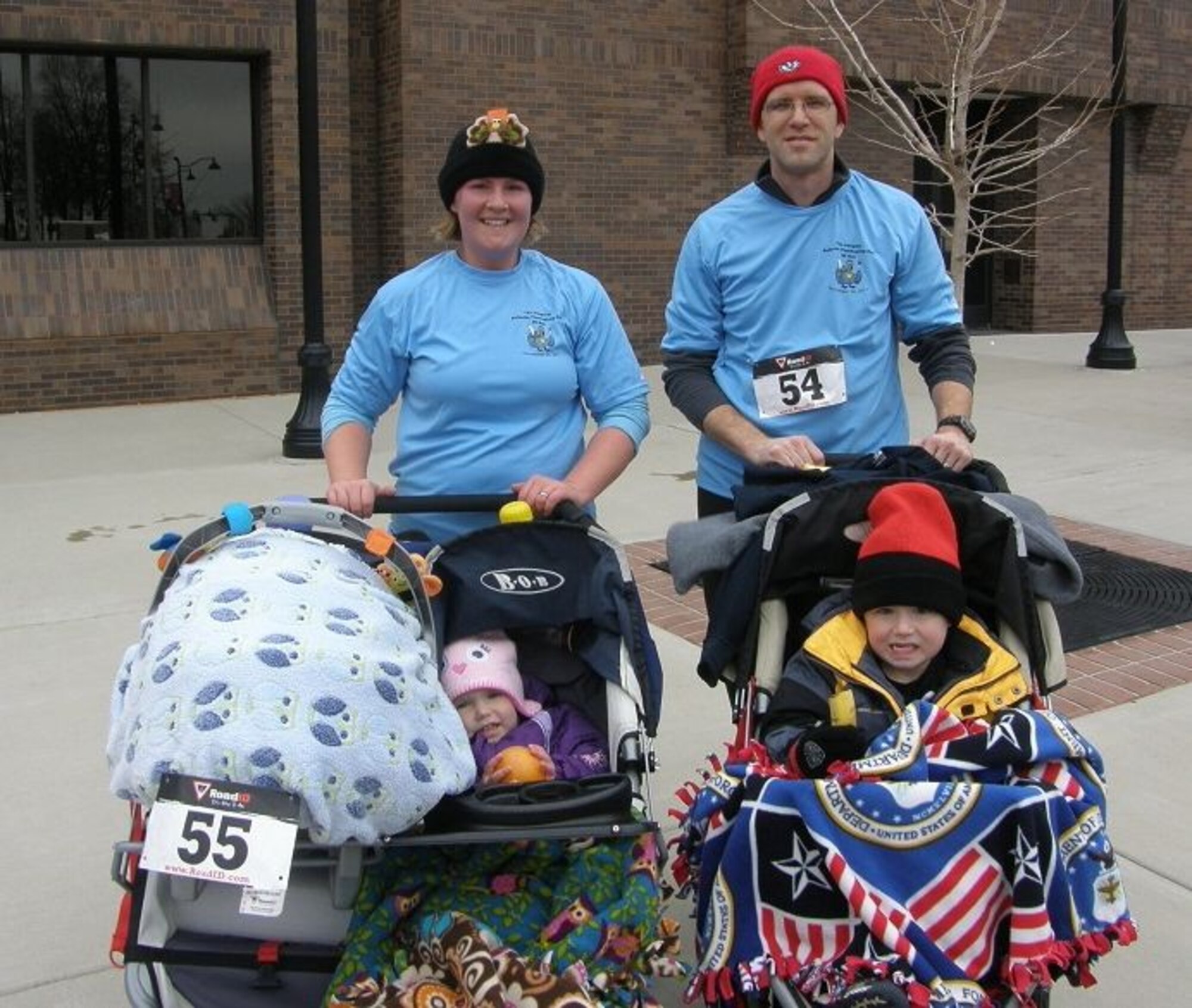 Melanie Truschinski and Maj. Ryan Truschinski, 618th Air and Space Operations Center (Tanker Airlift Control Center) Special Missions Division deputy chief, after running the Turkey Trot Thanksgiving morning in 2011 with their children Jason, Joyce and Noah. The Truschinski family has made running a family affair by involving their children and incorporating running into their everyday lives. (Courtesy photo)