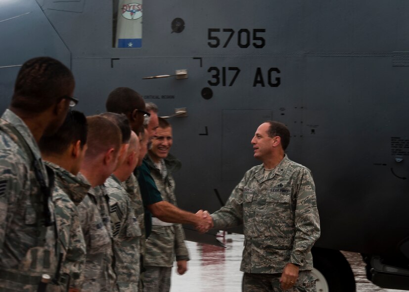 U.S. Air Force Brig. Gen. Lee Levy, Headquarters Air Mobility Command director of logistics, greets servicemembers of the 317th Airlift Group Sept. 13, 2012, after delivering the 23rd C-130J Super Hercules at Dyess Air Force Base, Texas. This is the 23rd C-130J of 28 to be delivered to Dyess by 2013, replacing the current legacy fleet of C-130H models. Once the final aircraft is delivered, Dyess will be home to the largest C-130J fleet in the world. (U.S. Air Force photo by Airman 1st Class Damon Kasberg/ Released)