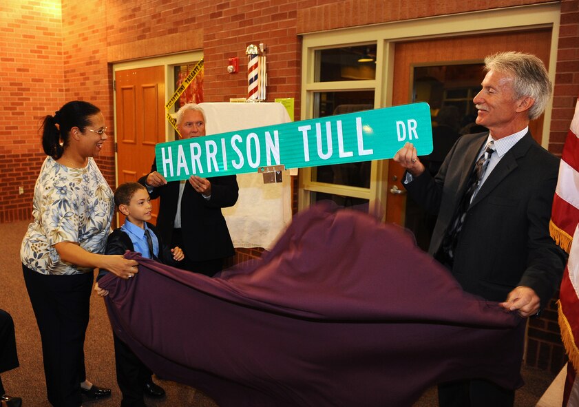 Janet Tull with her son Christopher, daughter and grandson of Harrison Tull of the Tuskegee Airmen, unveil the street sign named after their late father and grandfather and a formal ceremony held at the Easter Nebraska Veterans Home, Bellevue, Neb., Sept. 13.  Air Force Lt. Col. Harrison Tull was also a member of the 55th Wing Hall of Fame.  Two of his fellow Tuskegee Airmen were also in attendance for the road dedication. (U.S. Air Force photo by Josh Plueger/Released)