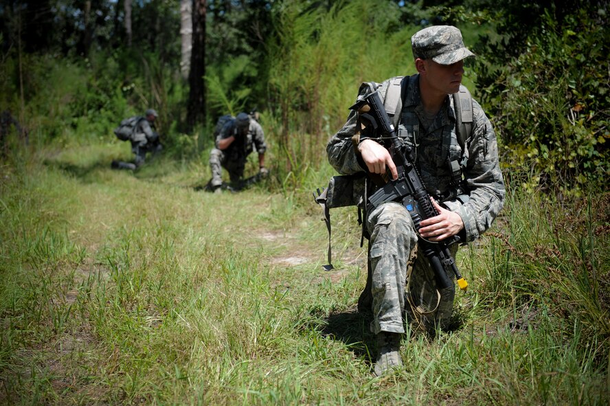 Airmen from the 820th Base Defense Group take a knee during Pre-Ranger Focus Training Course at Moody Air Force Base, Ga., Sept. 7, 2012. The training lasted six days and was designed to challenge participants physically and mentally. (U.S. Air Force photo by Senior Airman Douglas Ellis/Released)
