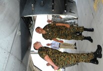 Bosnians Maj. Enes Dzinic and Capt. Zeljko Krajina look at the ammunition drum of the A-10C’s 30mm gun during a tour of Warfield Air National Guard Base in Baltimore, Md. on Friday, September 14, 2012.  (National Guard photo by Tech. Sgt. David Speicher)
