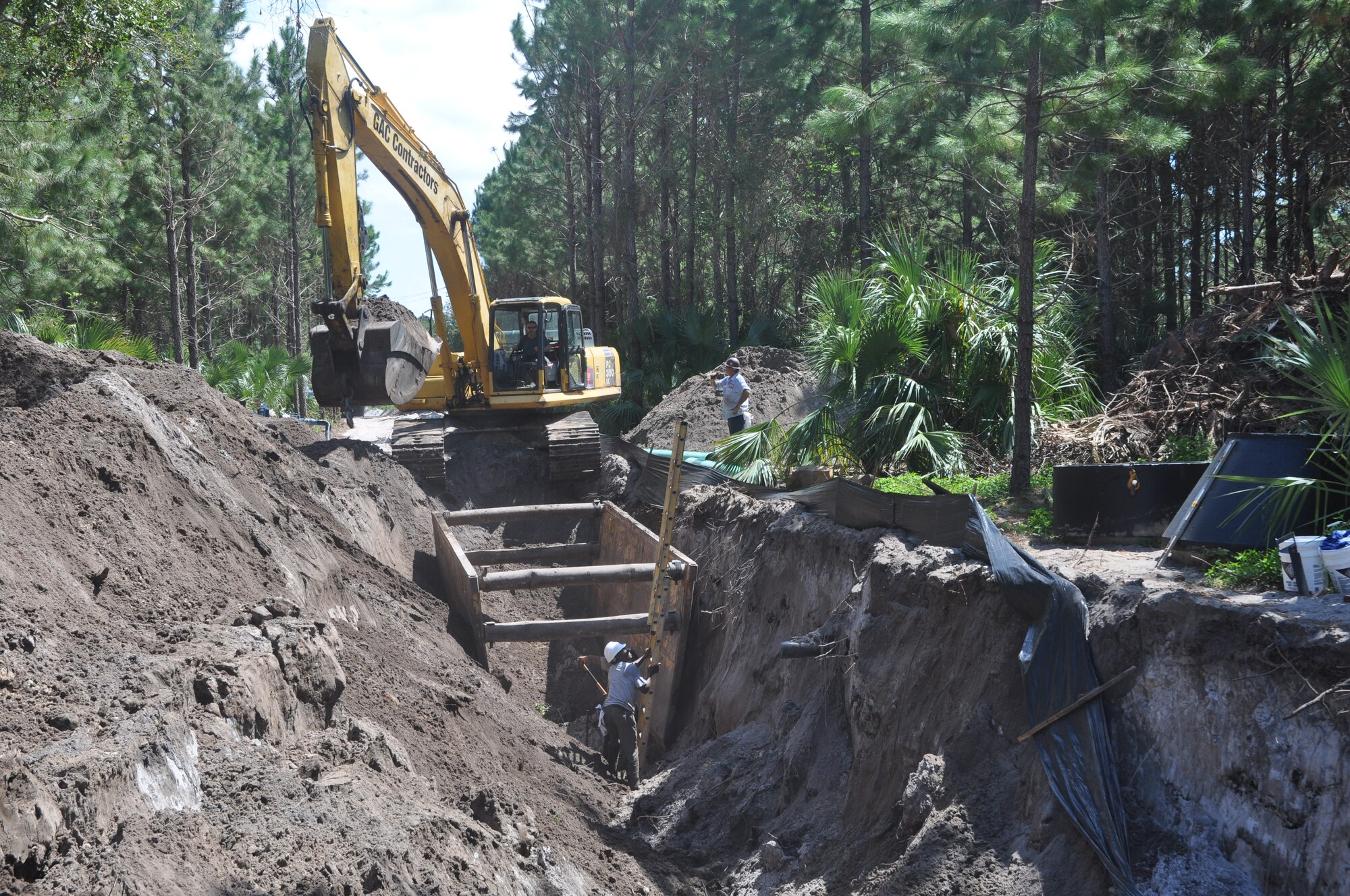Workers replace a section of sewage line alongside Jackson Avenue. The project is scheduled for completion Oct. 12. 