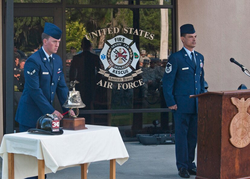 U.S. Air Force Airman 1st Class Donald Carey, 23d Civil Engineer Squadron firefighter, rings a traditional firefighter bell known as the “Last Call,” for the 9/11 Remembrance Ceremony Sept. 11, 2012, at Moody Air Force Base, Ga. The Last Call is held during funeral services and once also signaled the start and end of an alarm for firefighters. (U.S. Air Force photo by Senior Airman Eileen Meier/Released)