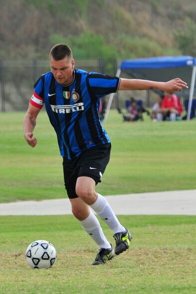 Chris Cerny, 56th Logistics Readiness Squadron flight service center craftsman, takes the ball down field during the Falcons’ first game. Cerny played a defender position for six games in two days. Most games were played with two-to-three hour breaks between them. (U.S. Air Force photo by Staff Sgt. Jaime Ciciora)