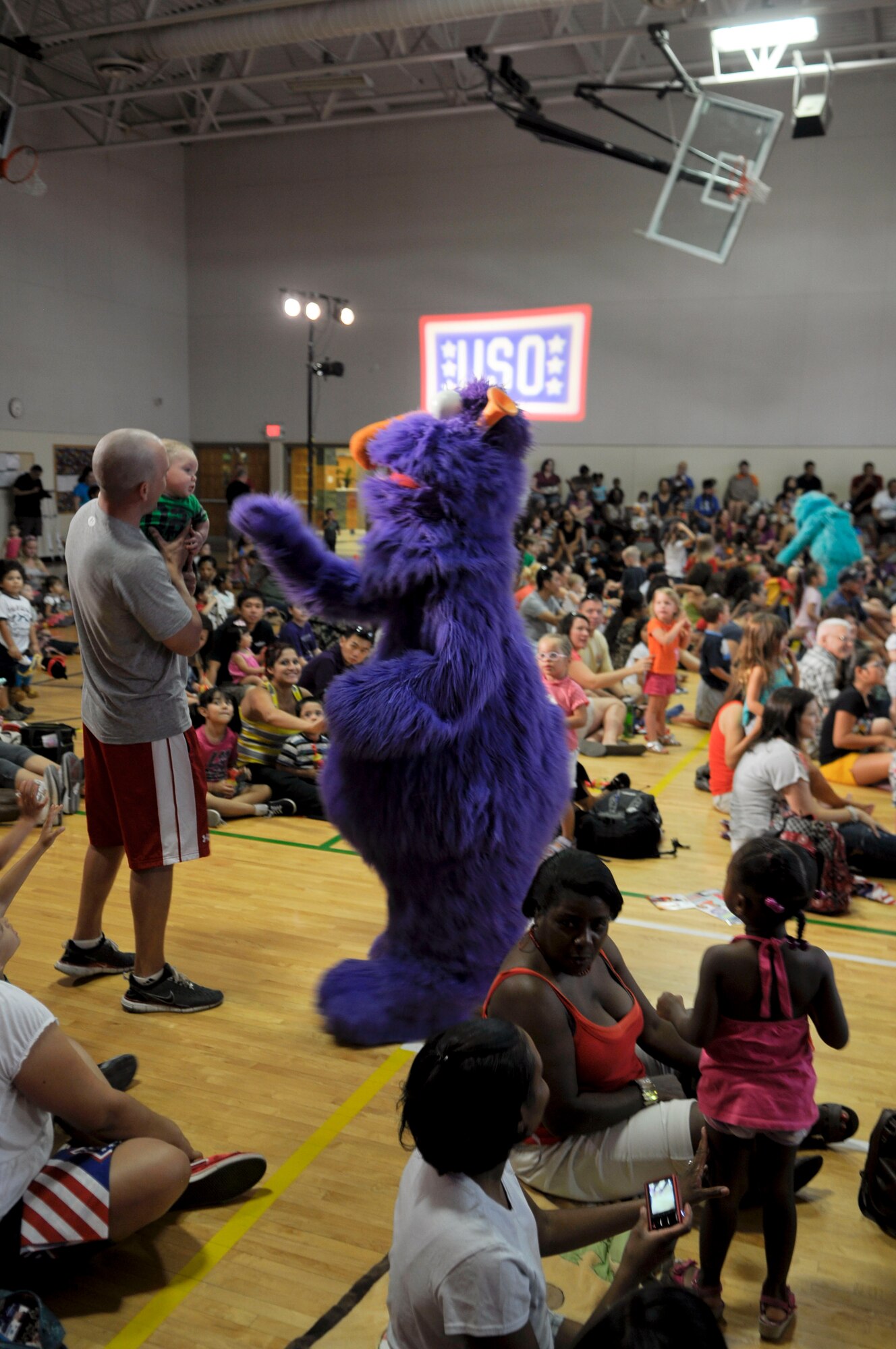 Honker, one of the Sesame Street characters, interacts with the crowd during the performance. (U.S. Air Force photo by Senior Airman C.J. Hatch)