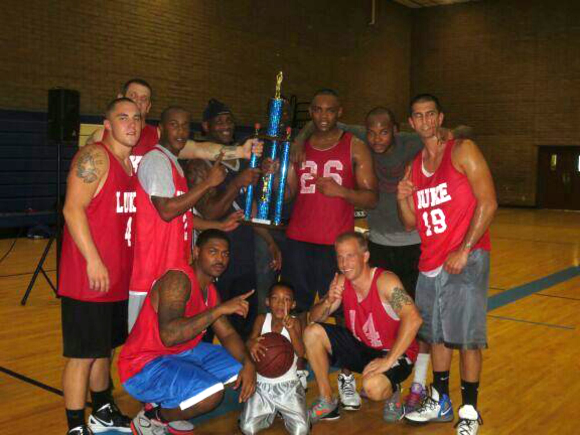 The 56th Security Forces Squadron intramural basketball team poses for a picture Aug. 16 after winning the intramural basketball championship at the Bryant Fitness Center. SFS defeated the 56th Civil Engineer Squadron 61-45.  (U.S. Air Force photo by Airman 1st Class David Owsianka)