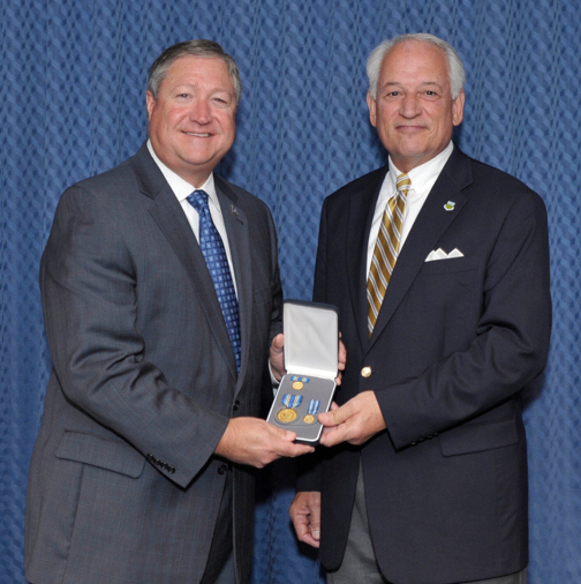 The Secretary of the Air Force, the Honorable Michael Donley, presents the Distinguished Public Service Award to Dr. Jack Hawkins in a ceremony held at the Pentagon on Sept. 6. Dr. Hawkins is the former chair of the Air University Board of Visitors. (Photo by Michael J. Pausic) 