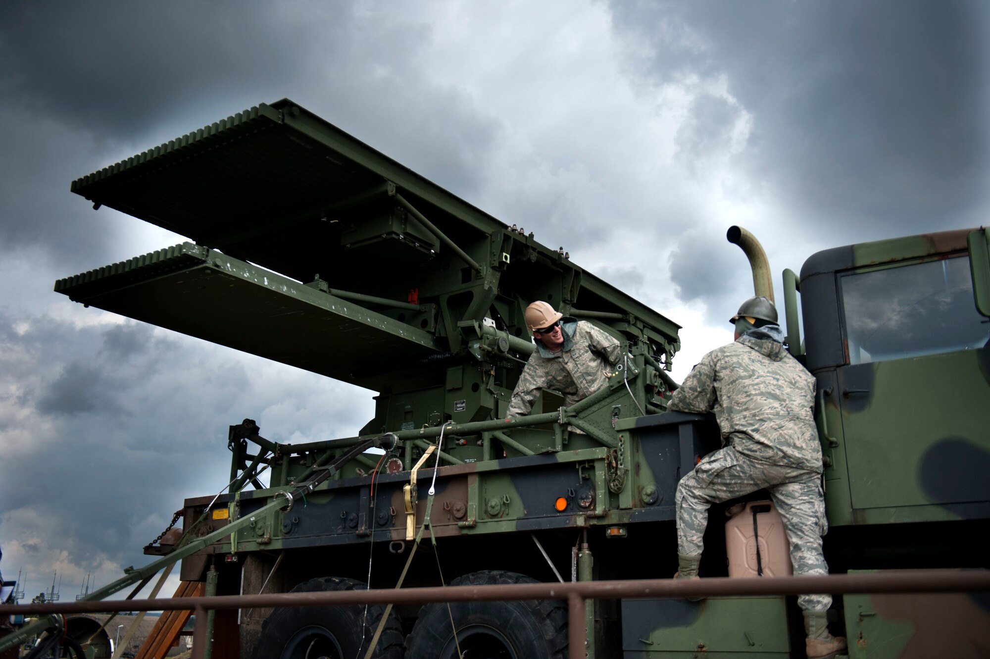 SPANGDAHLEM AIR BASE, Germany – U.S. Air Force Senior Airman Garret Adams, left, and Airman Ethan Wood, 606th Air Control Squadron ground radar systems technicians operate an AN/TPS-75 transportable aerospace control and warning radar Sept. 12 here, during a visit from the Bulgarian air force.  The tour serves as a way for the United States and Bulgaria to learn and exchange ideas about each other’s air force to ensure air dominance in any contingency operation. (U.S. Air Force photo by Airman 1st Class Gustavo Castillo/Released)