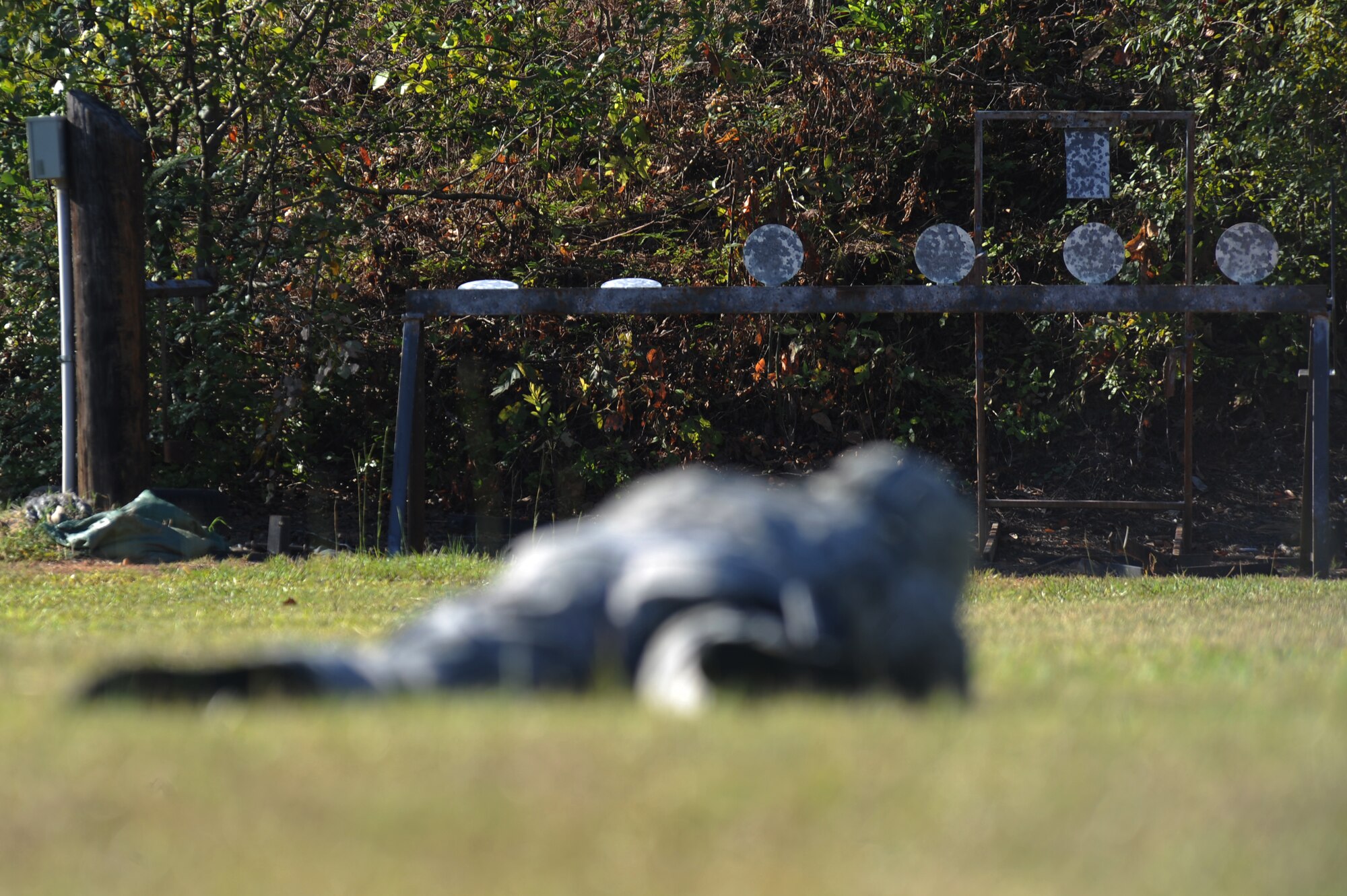 An Airman from the 2nd Security Forces Squadron aims at a target with an M-9 pistol at the Bossier Parish Sheriff?s Office pistol range in Plain Dealing, La., Sept. 11. Airmen from the 2 SFS spent the morning firing the M-9 at various targets to prepare for the 2012 annual Global Strike Challenge. (U.S. Air Force photo/Senior Airman Micaiah Anthony)(RELEASED)
