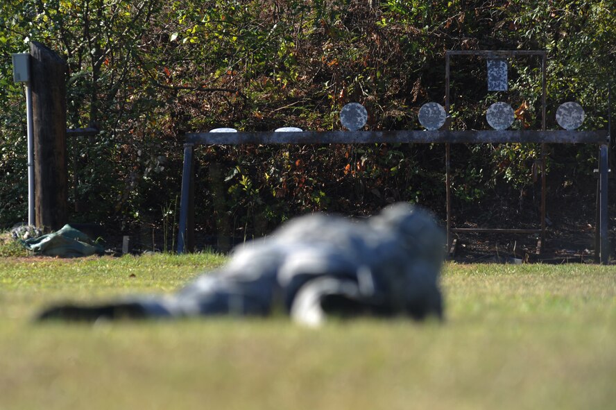 An Airman from the 2nd Security Forces Squadron aims at a target with an M-9 pistol at the Bossier Parish Sheriff?s Office pistol range in Plain Dealing, La., Sept. 11. Airmen from the 2 SFS spent the morning firing the M-9 at various targets to prepare for the 2012 annual Global Strike Challenge. (U.S. Air Force photo/Senior Airman Micaiah Anthony)(RELEASED)