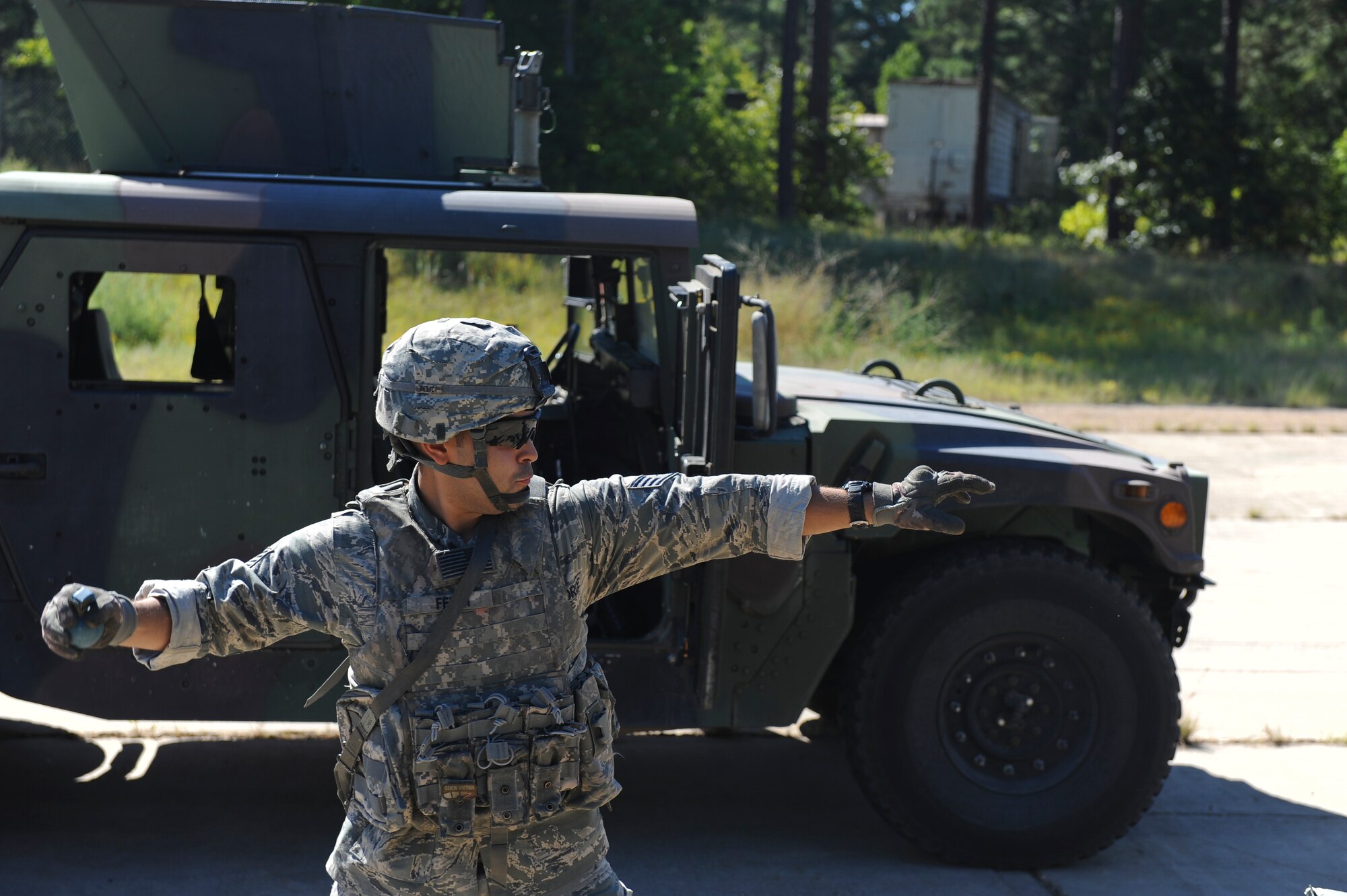Staff Sgt. Aldo Felici, 2nd Security Forces Squadron, prepares to throw a training grenade on Barksdale Air Force Base, La., Sept. 10. Airmen from the 2 SFS practiced throwing training grenades and firing weapons in preparation for the 2012 annual Global Strike Challenge. Training grenades have a small amount of explosives in the fuse to simulate the timing in which a grenade would explode. Though the amount of explosives may be small, the grenades can still inflict injuries if handled incorrectly. (U.S. Air Force photo/Senior Airman Micaiah Anthony)(RELEASED)