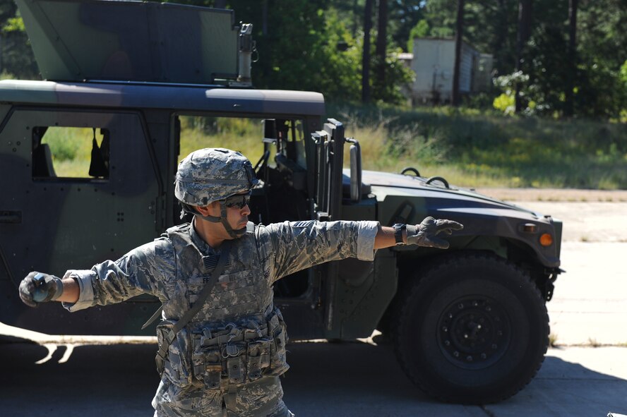 Staff Sgt. Aldo Felici, 2nd Security Forces Squadron, prepares to throw a training grenade on Barksdale Air Force Base, La., Sept. 10. Airmen from the 2 SFS practiced throwing training grenades and firing weapons in preparation for the 2012 annual Global Strike Challenge. Training grenades have a small amount of explosives in the fuse to simulate the timing in which a grenade would explode. Though the amount of explosives may be small, the grenades can still inflict injuries if handled incorrectly. (U.S. Air Force photo/Senior Airman Micaiah Anthony)(RELEASED)