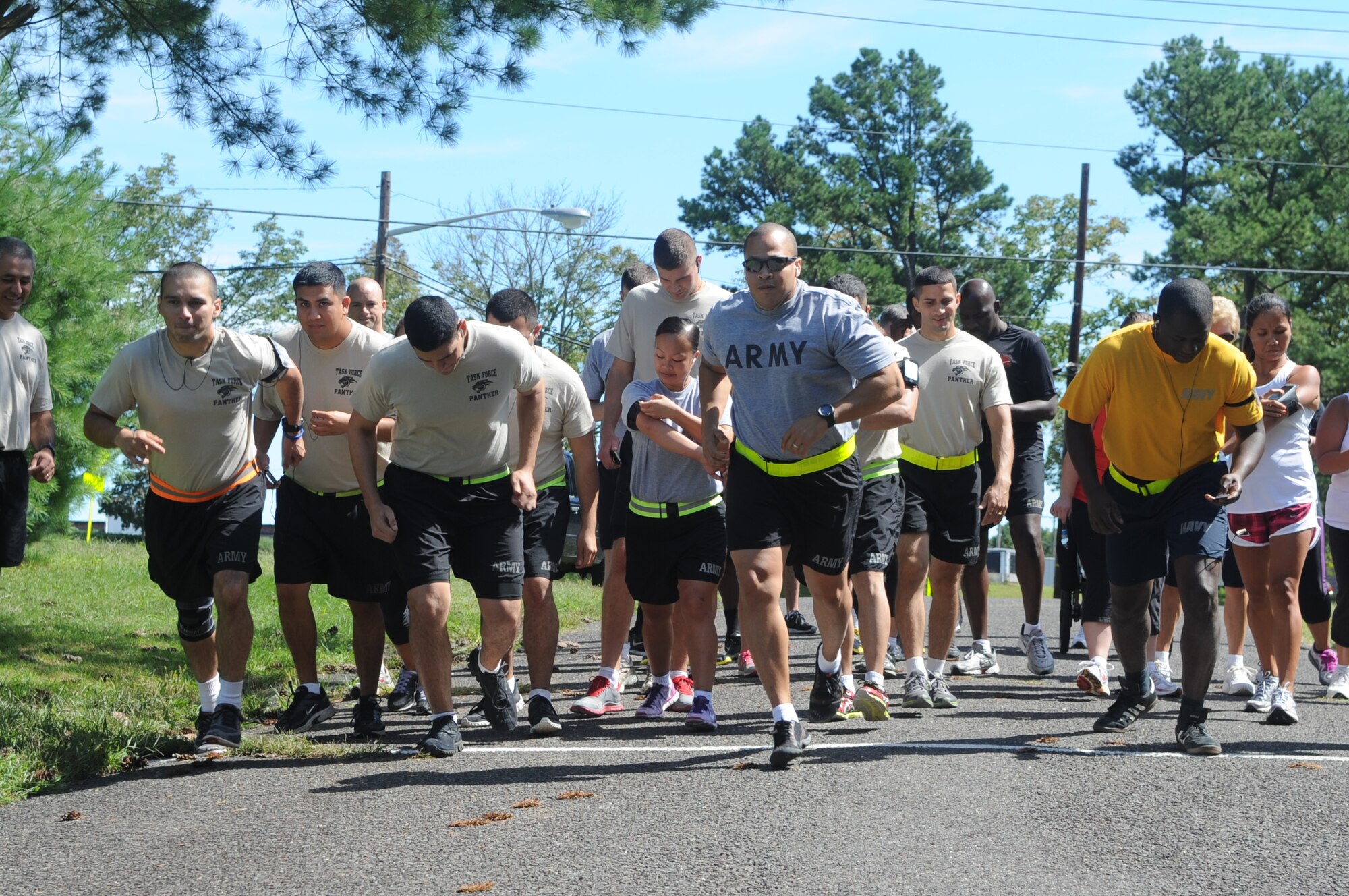 Joint base service members take part in the Remembrance Run 5K in honor of the fallen Sept. 11 at the Lakehurst Fitness Center. Medals were awarded to the three fastest men and women. (U.S. Air Force photo by Kim Wright/Released) 