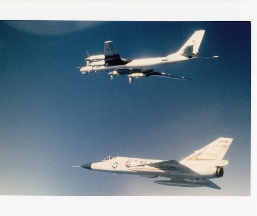An F-106A Delta Dart of the Massachusetts Air National Guard escorts a Soviet Tu-95RT (“Bear”) maritime surveillance aircraft off Cape Cod, 1982.