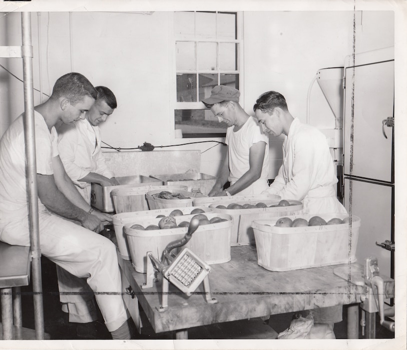 Some things stayed the same after the Air National Guard became a separate organization. Airmen on KP peel potatoes during summer training camp, 1952.