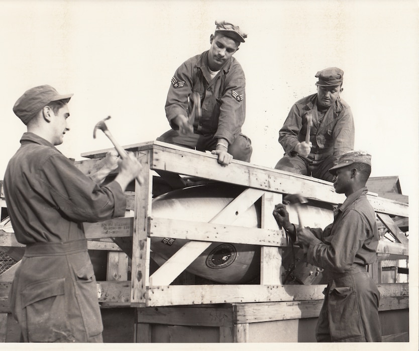 Airmen of the 117th Tactical Reconnaissance Wing, Georgia Air National Guard, crate a wingtip fuel tank for an RF-80 jet. The 117th was preparing to deploy to Europe. Lawson Air Force Base, Columbus, Georgia, January 1952.