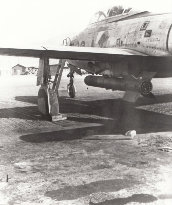 An F-84 of the 154th Fighter-Bomber Squadron, Arkansas Air National Guard, loaded with 11.75-inch Tiny Tim rockets, Taegu, Korea, February 1952. Developed late in World War II for use against shipping and fortified targets, the Tiny Tim mated a 500-pound semi-armor-piercing bomb with a rocket motor built into a length of oil well tubing. Photo by C.W. Ellis, courtesy of Warren Thompson.