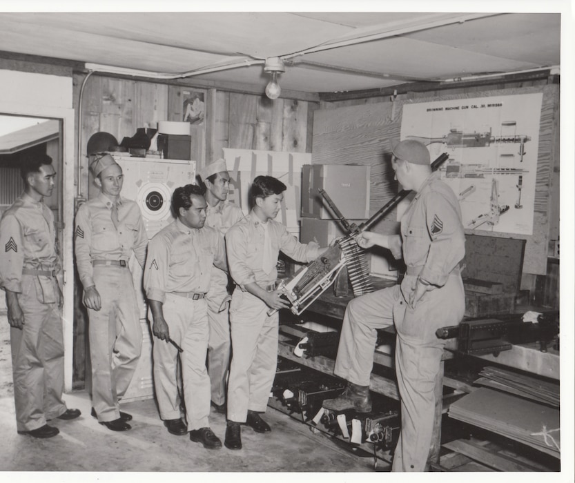Armament specialists of the Hawaii Air National Guard train to load the .50-caliber machine guns used in the F-47 Thunderbolts that made up the bulk of the early ANG aircraft inventory.