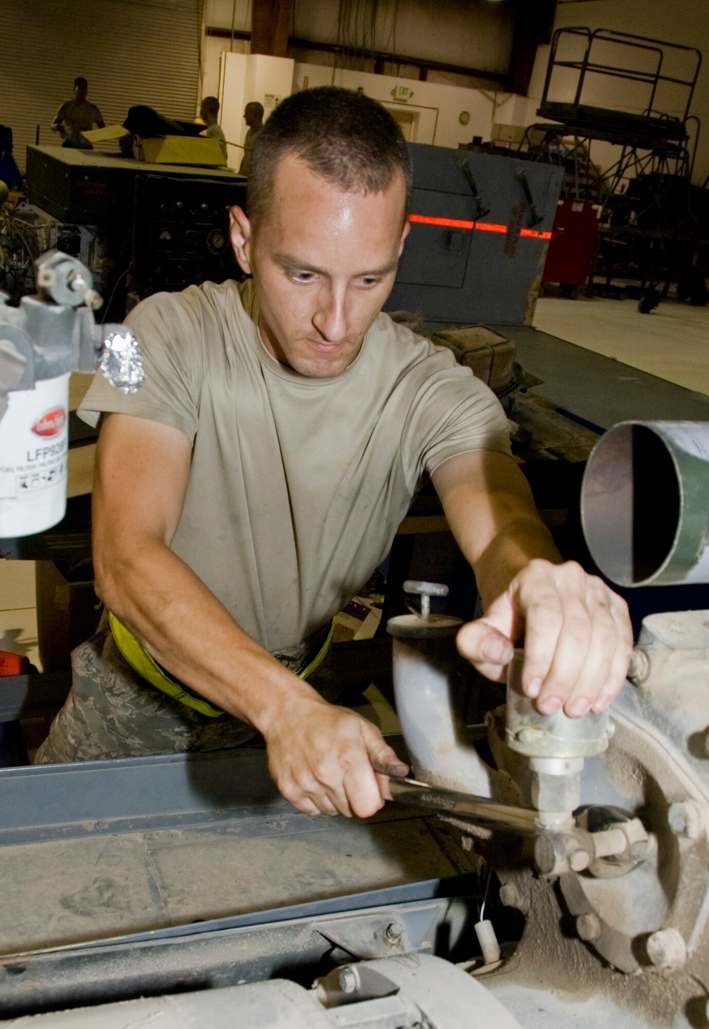Staff Sgt. Robert Woodring, 379th Expeditionary Maintenance Squadron Aerospace Ground Equipment Flight craftsman, removes a tachometer generator during a diesel engine
Replacement Aug. 29, 2012. The AGE Flight essentially duplicates aircraft systems while on the ground. Everything from cooling, electrical power generation and hydraulics to small maintenance stands. (U.S. Air Force photo/Senior Airman Bryan Swink)

