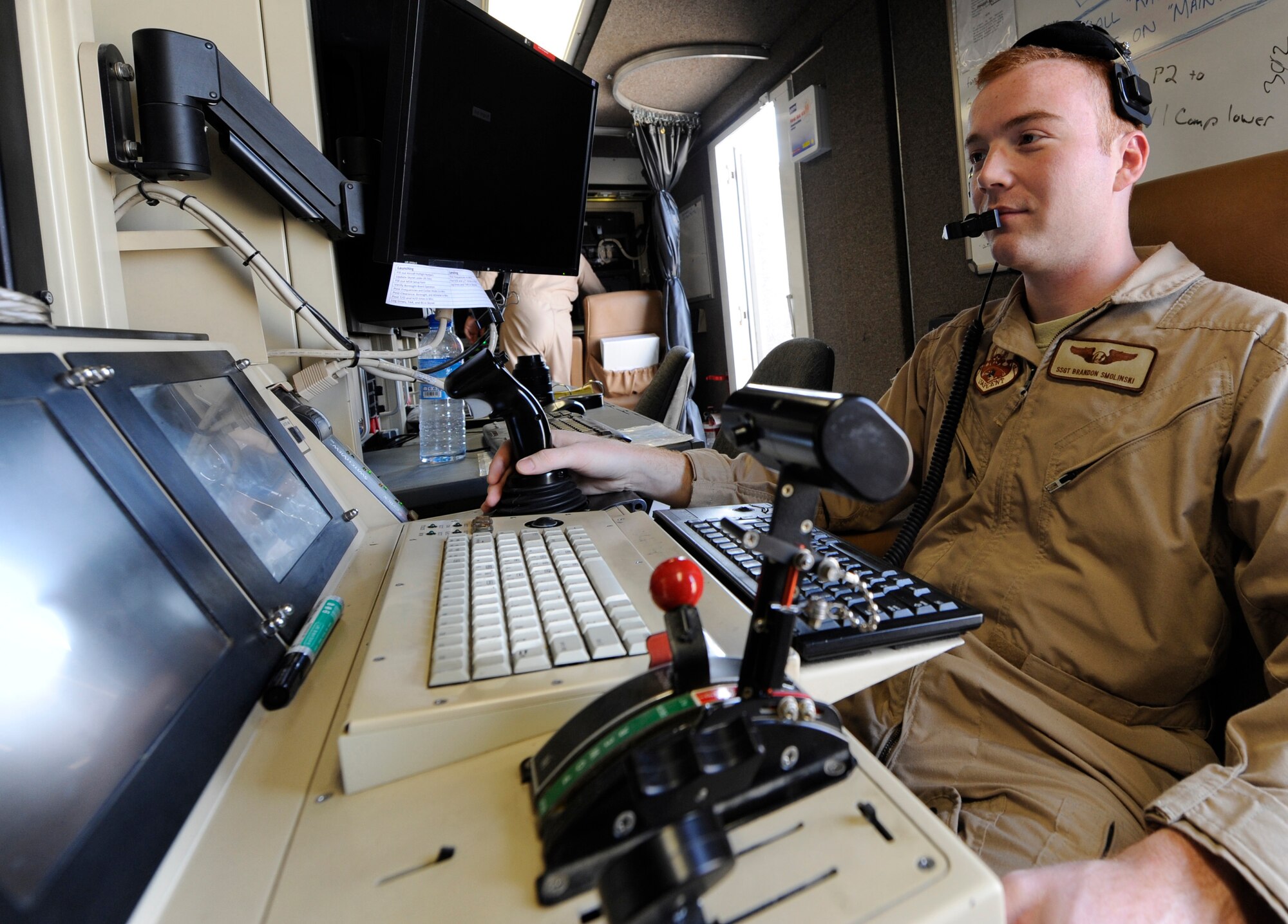SOUTHWEST ASIA – Staff Sgt. Brandon Smolinski, 46th Expeditionary Reconnaissance Squadron sensor operator, performs co-pilot duties during launch and recovery procedures to support national objectives. Smolinski prepares, inspects, and services individual aircraft to ensure mission readiness as well as launch, perform system checkouts and recover and land the aircraft. Smolinski is the 386th Air Expeditionary Wing Rock Solid Warrior. (U.S. Air Force photo/Staff Sgt. Alexandra M. Boutte)