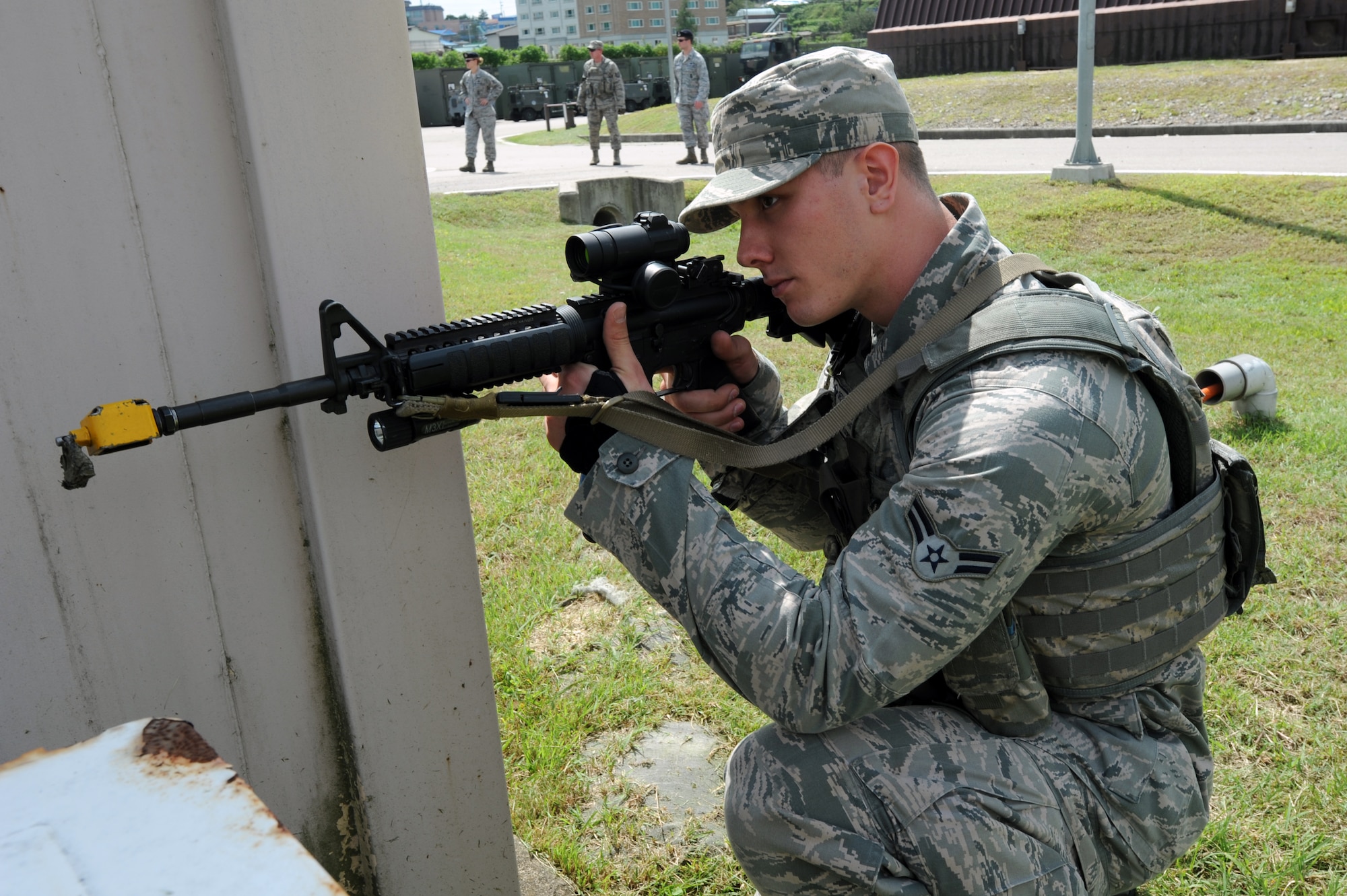 Airman 1st Class Joshua Plucinksi, 51st Security Forces Squadron Quick Reaction Team member, provides security during a training scenario at Osan Air Base, Republic of Korea, Sept. 8, 2012. The 51st SFS’s QRT is trained to respond to high risk scenarios and serves as a response force for Osan. (U.S. Air Force photo/Airman 1st Class Alexis Siekert)
