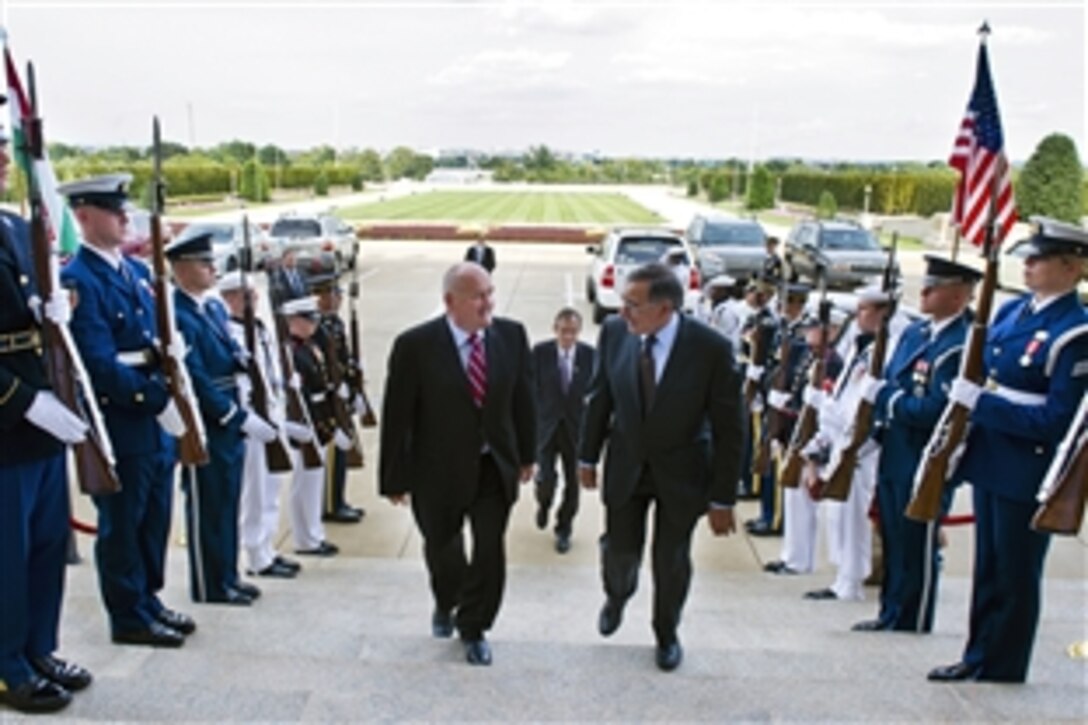 Defense Secretary Leon E. Panetta escorts Hungarian Defense Minister Csaba Hende through an honor cordon at the Pentagon Sept. 14, 2012.