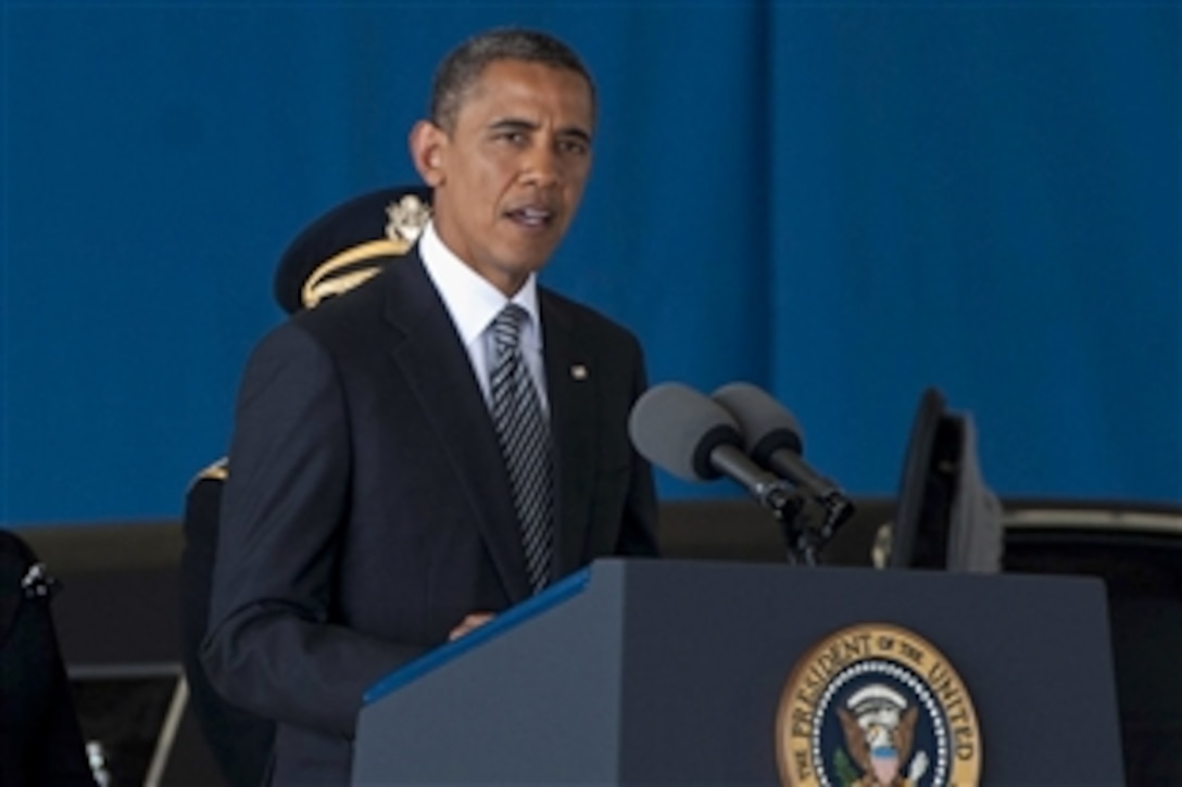 President Barack Obama speaks at the dignified transfer ceremony for the U.S. Ambassador to Libya J. Christopher Stevens, Foreign Service officer Sean Smith, and security officers Tyrone S. Woods and Glen A. Doherty on Joint Base Andrews, Md., Sept. 14, 2012. 