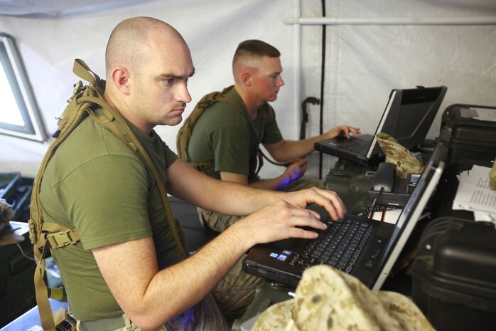 Marines with Communications Company, Combat Logistics Regiment 27 work on providing e-mail servers during a field exercise aboard Camp Lejeune, N.C., Sept. 11, 2012. The Marines monitor the servers that give more communication opportunities between sections of two training sites within six miles of each other. 